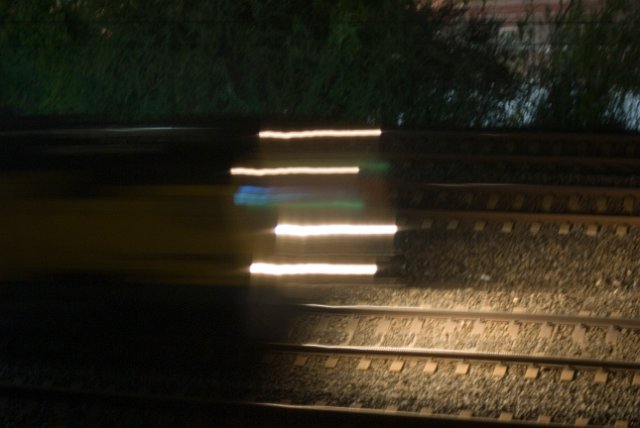 blurred lights of a passing train