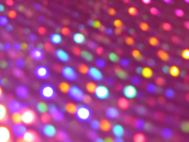 diffuse colorful specturm of out of focus lights with a purple warm tint