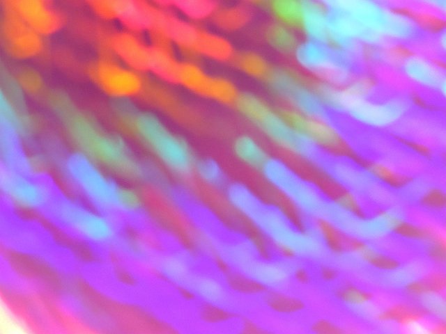 ethereal motion blurred color background with all the colours of the rainbow