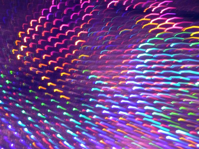brightly coloured background of blurred light trails