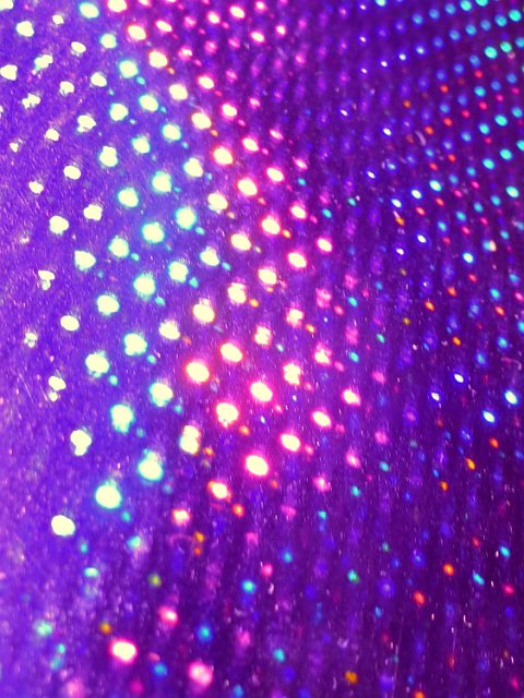 purple metallic background with a gradient of cyan and pink highlights