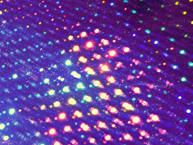 a grungy gritty background with brightly coloured highlight spots