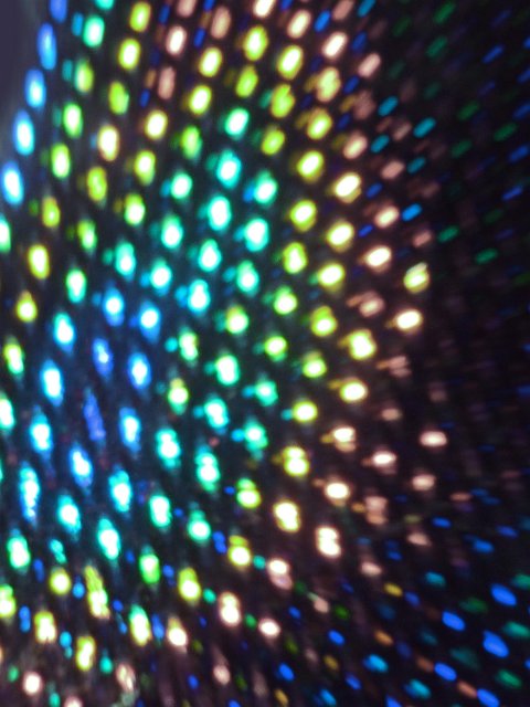 an array of colourful lights with a dreamy motion and defocused effects