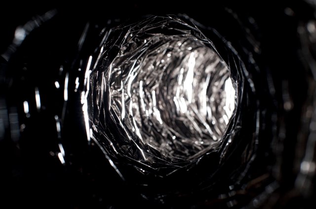 light reflecting through a metallic light tunnel