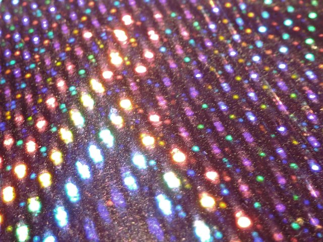 specular reflecting highlights on a metallic foil backdrop