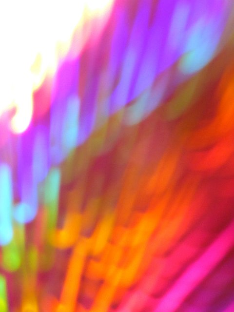 soft vertical background with diffuse streaks of coloured light