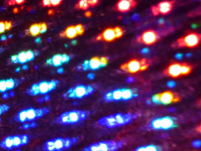 iridescent coloured created with lights shining onto a holographic film