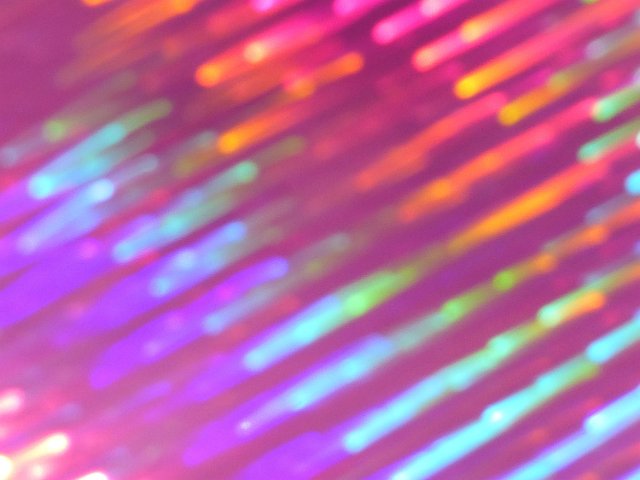 a creative background of vivid colour and movement strips on pink or purple