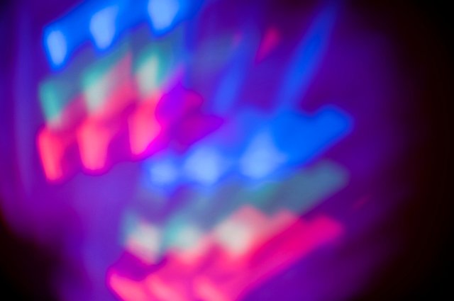 colorful mixing points of light in red green and blue