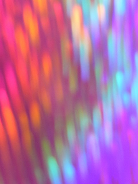 dusky coloured defocused motion blur forming a colourful background