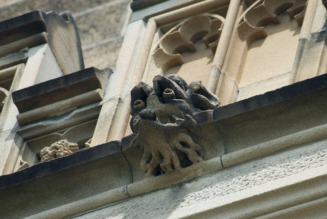 sad looking grotesque stone scuplture