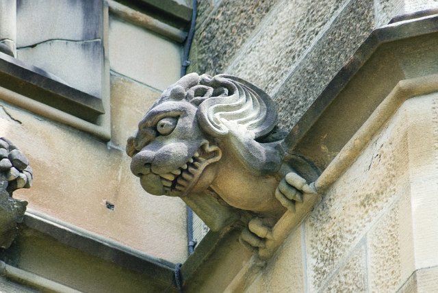 stone scuplture with gnashing teeth and wavy hair