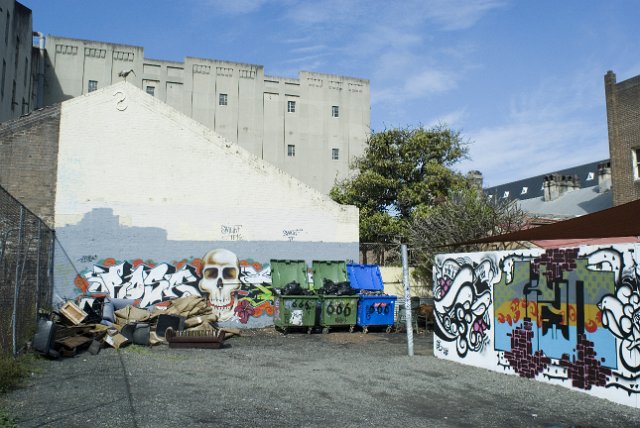 a courtyard covered in graffiti