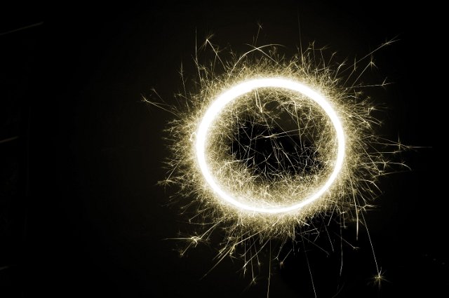 a circle of light surrounded by sparks
