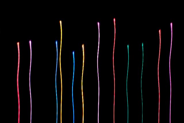 multicoloured lights with trails falling to the bottom of the frame