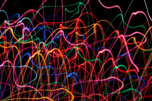 a backdrop of colorful light trails