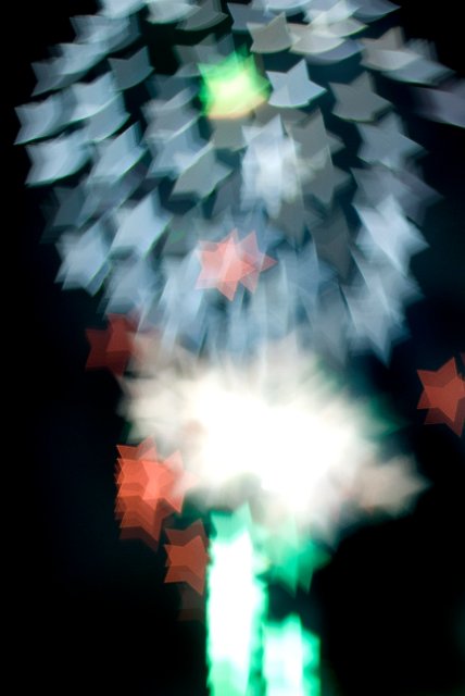 bokeh star shapes falling from the sky