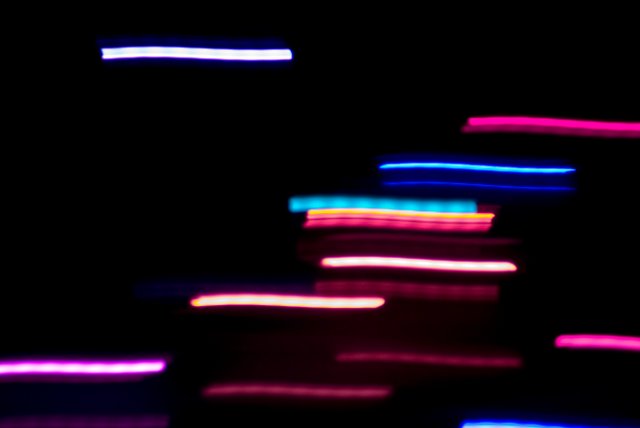 blurred motion trails, a long exposure of some moving coloured light