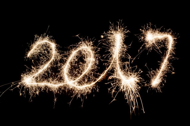 sparkling trails of light drawing out the numbers 2017 in glowing light to welcome in the new year