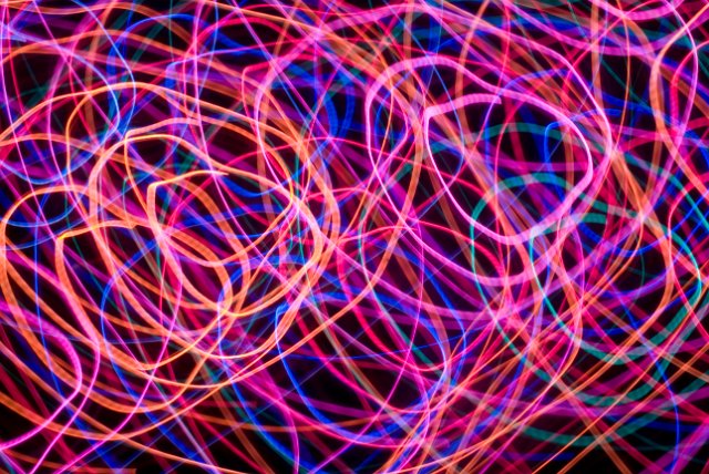 a tangle of purple and pink light trails