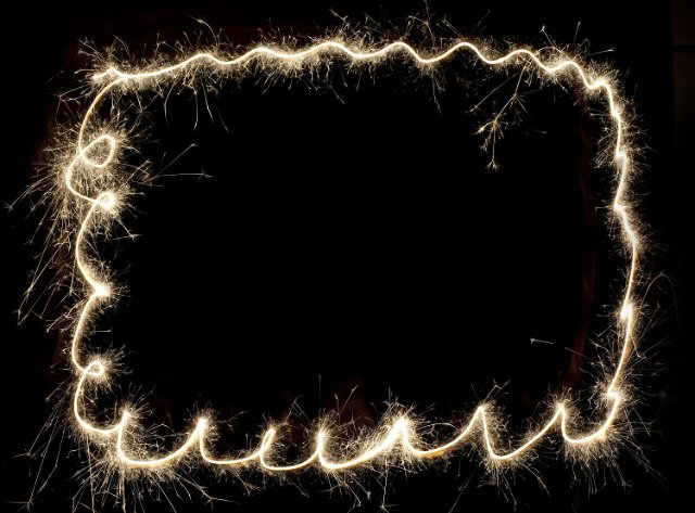 an border design created with a sparkler - space for text