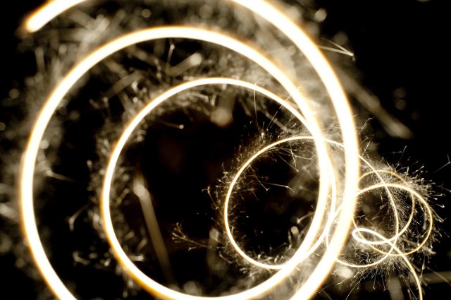 close up on a sparkler plotting a decaying spiral pattern