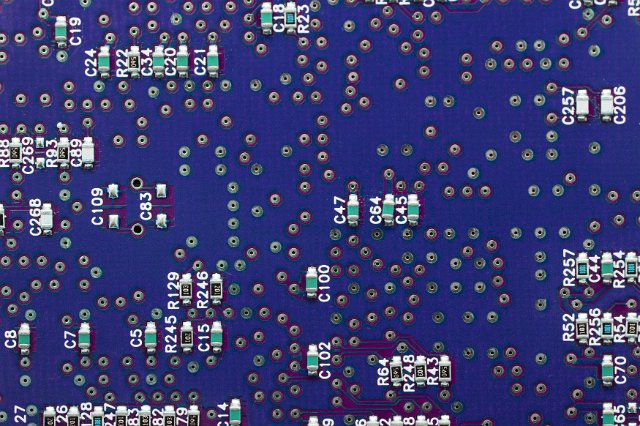 Blue and purple electronic circuti board with diods and markings in close-up for engineering full frame background concept