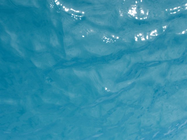 the texture of aqua-marine waters surface