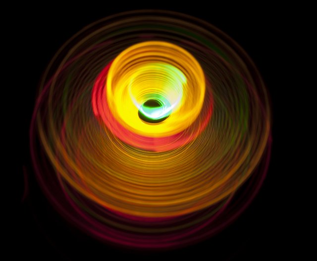 a whirlpool like spiral of colorful light