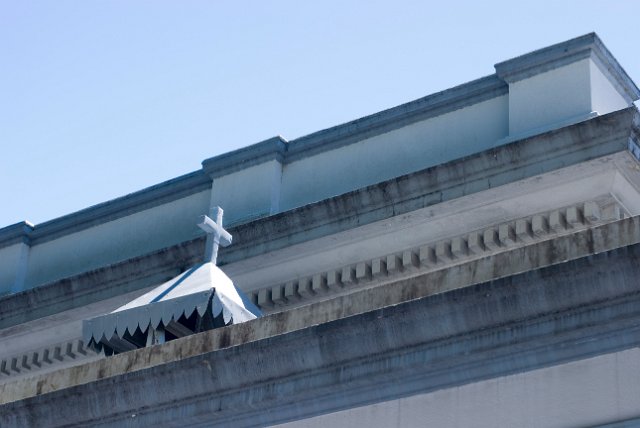 close up on detailed cornice work and a cross