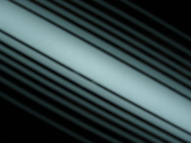 white illuminated lines in a mirror