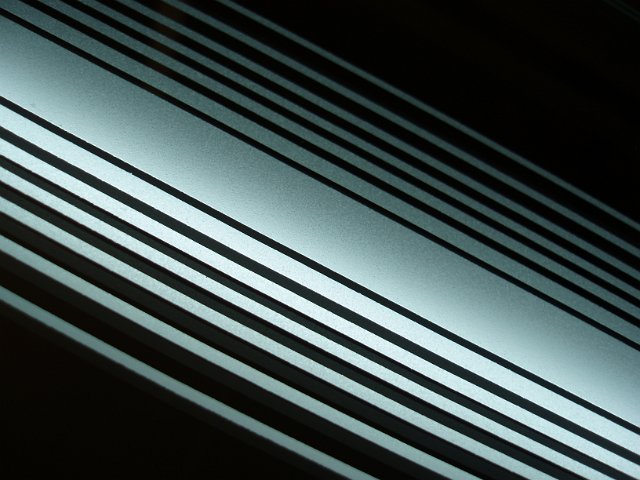 white illuminated lines in a mirror