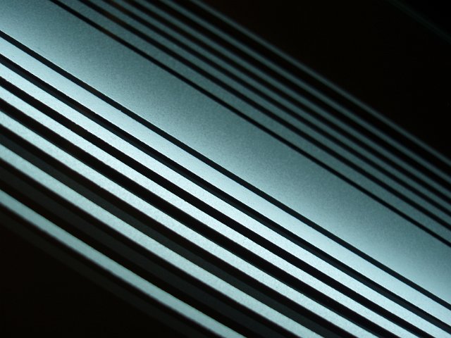 white illuminated lines in a mirror