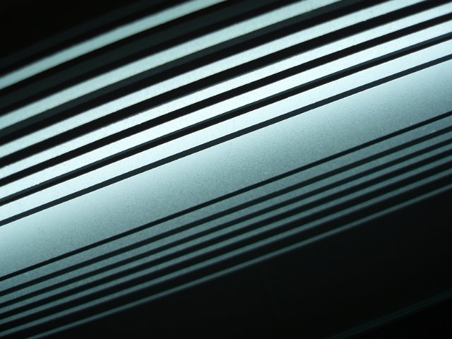 white illuminated lines in a mirror