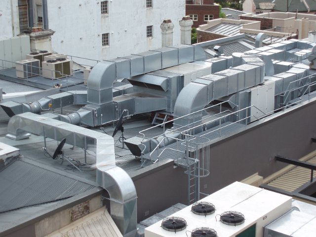 complex interconnecting air ducting on a roof top