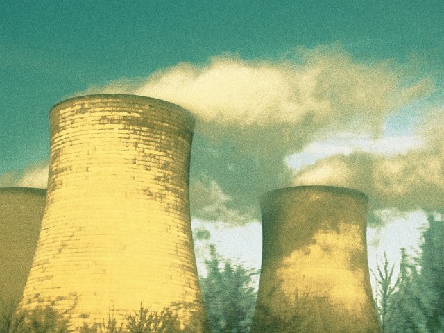 power station cooling towers with steam and cross processed effect