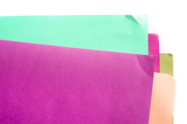 A series of overlapped sheets of colourful paper