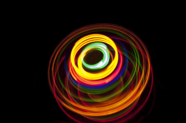glowing overlapping circles of yellow orange red green and blue