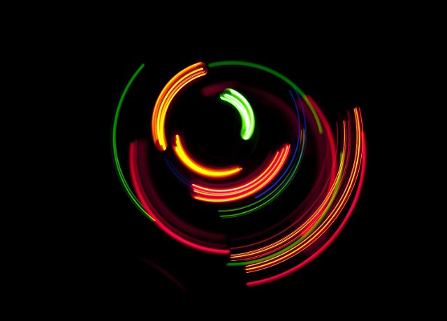 an interesting background image composed of bright vividly coloured arcs of light