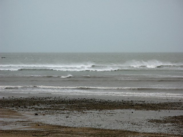 surf being blown sideways by a stong wind